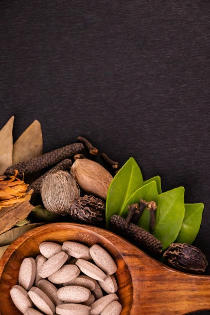 imgi_59_traditional-medicine-concept-close-up-of-herbal-pills-in-a-wooden-spoon-shot-from-the-top